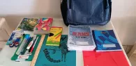 155 kinderen in Nickerie blij met gevulde schooltas